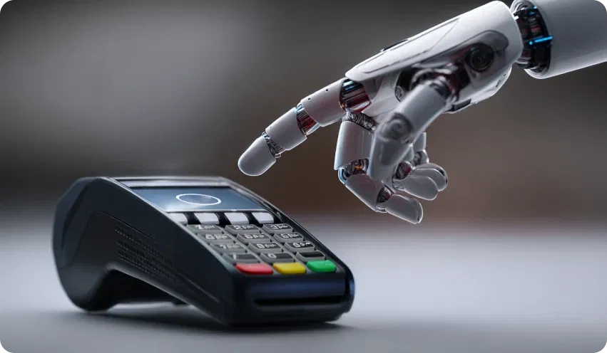 EC-Kartengerät über dem eine Roboterhand schwebt und eine Zahlung tätigen will: Symbolisch für Agentic Commerce